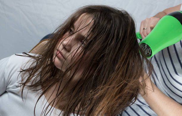istock Mother drying hair to her daughter 658756404
