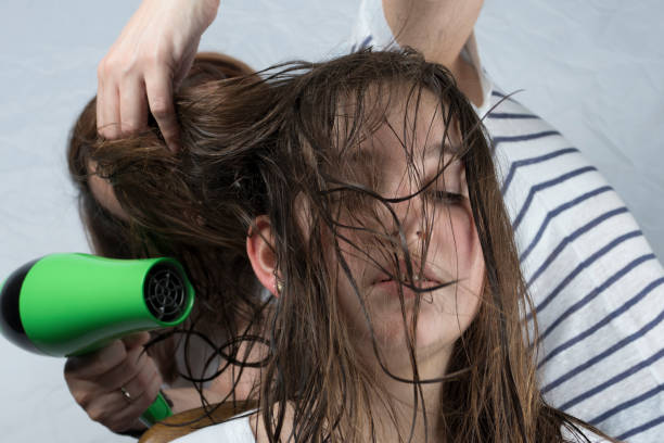 istock Mother drying hair to her daughter 658756896