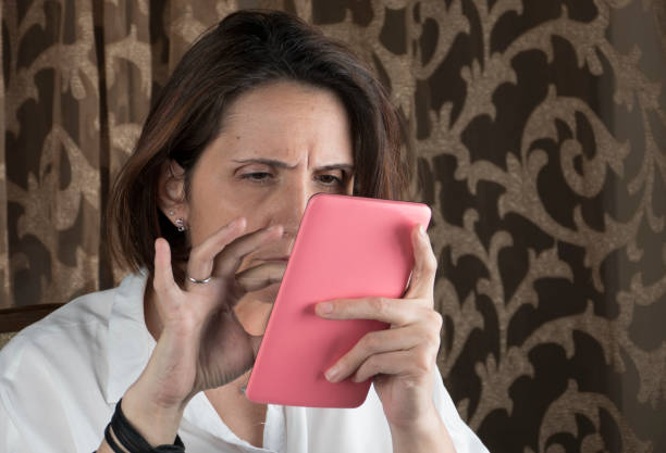 istock Young woman using tablet and sitting in a chair 658787282