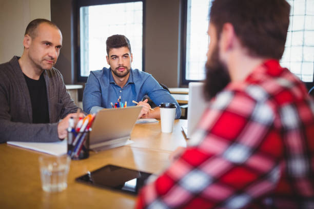 istock Business people discussing at desk 658790216
