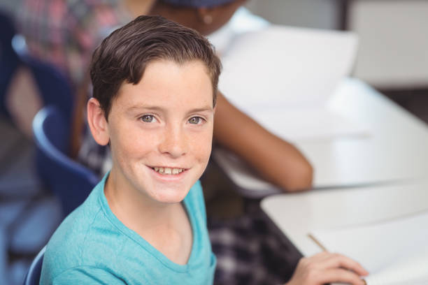 istock Portrait of smiling schoolboy 658793198