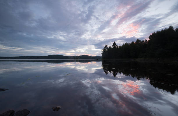 istock Twilight scene over a calm lake in sweden 658802906