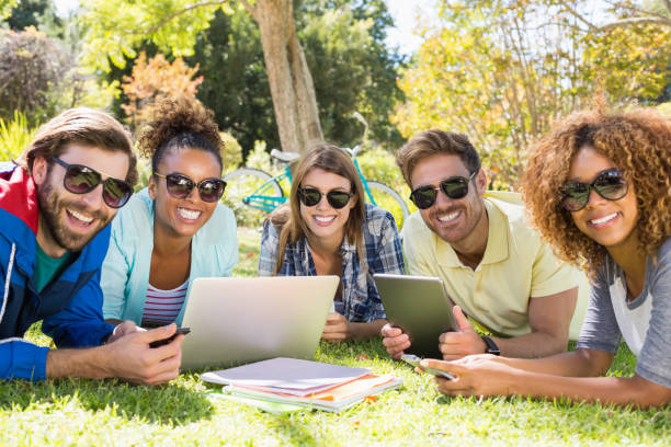 istock Group of friends using laptop, mobile phone and digital tablet 658803536