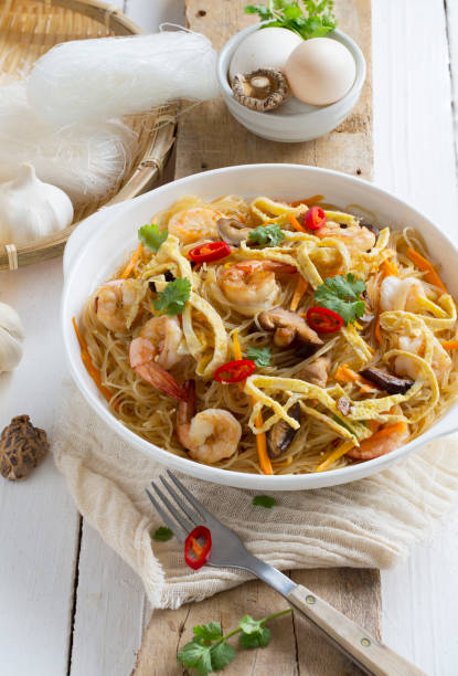 istock Fired rice vermicelli or rice noodle served in white plate. 658804582