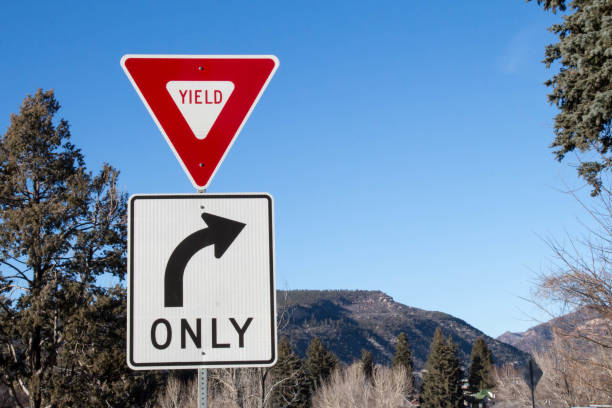 Yield sign and blue sky.