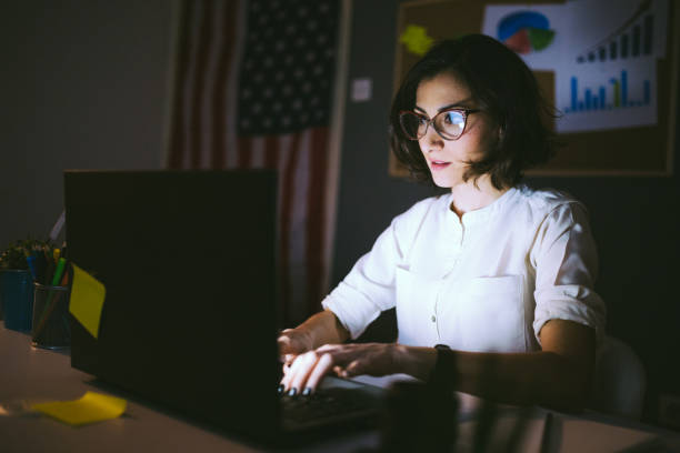 istock Young Woman Working Late 658817922