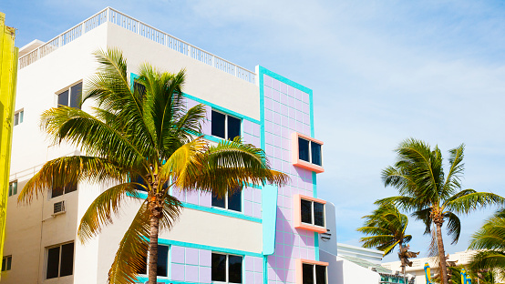 Colorful buildings in South Miami Beach with palm trees, and blue sky. Miami, Florida