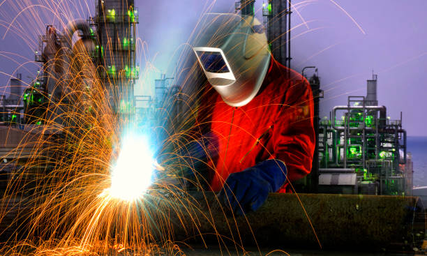 istock Industrial worker cutting and welding metal with many sharp sparks, 658821806