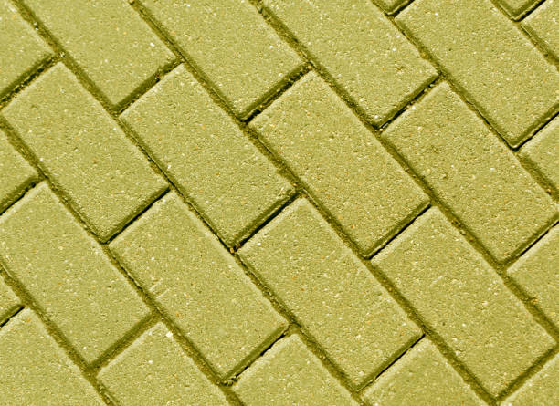 istock Yellow color cobblestone pavement close-up. 658827258