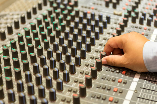 istock The hand adjust mixer table or fader board 658836084