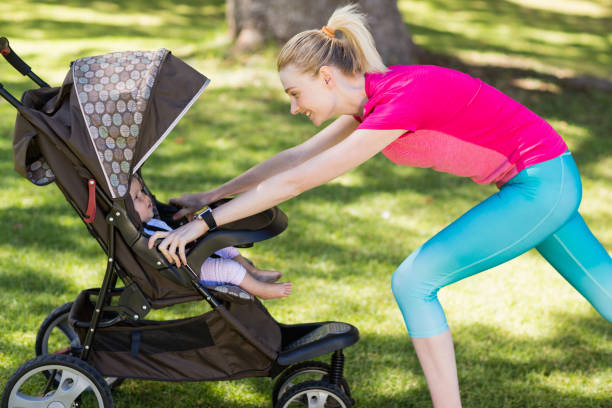 istock Woman exercising with baby stroller 658839344