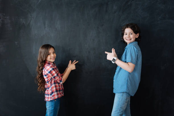 istock Smiling kids helping in decision in the studio 658847684