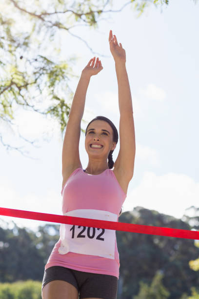 istock Cheerful winner athlete crossing finish line 658855426