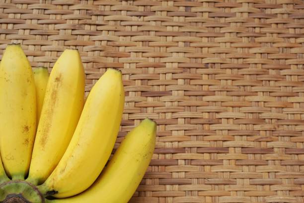 istock banana on wood background. 658858514