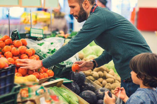 istock Father and Son In A Supermarket. 658862258