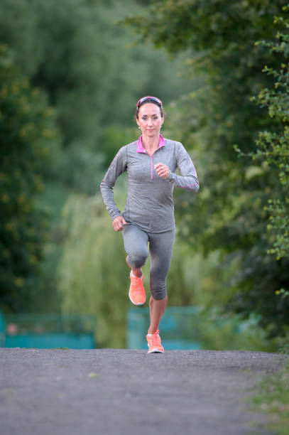 istock woman athlete running at workout 658862530