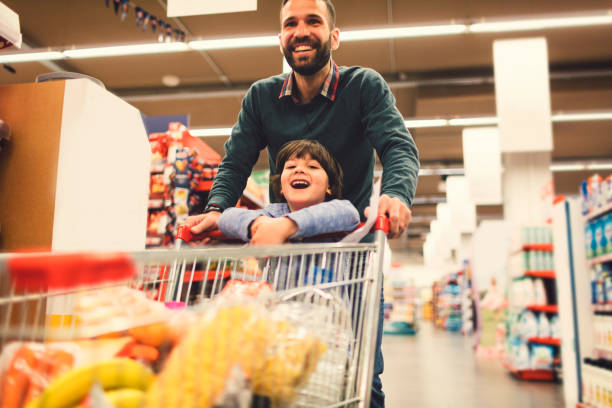 istock Father and Son In A Supermarket. 658862806