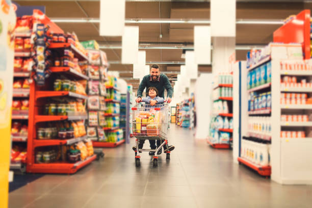istock Father and Son In A Supermarket. 658862858