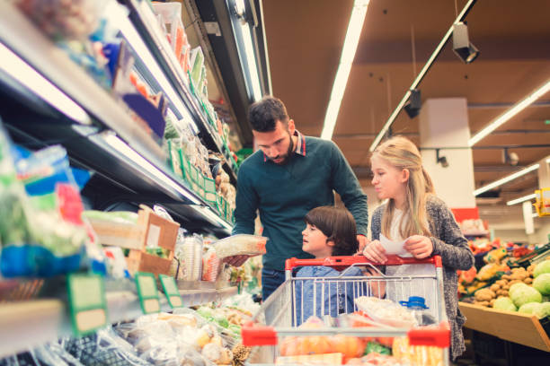 istock Father with son and daughter In A Supermarket. 658866814
