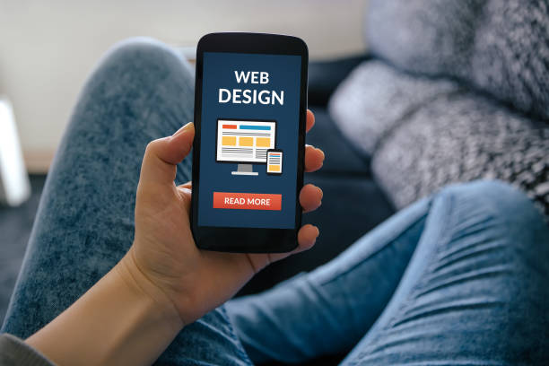 istock Girl holding smart phone with web design concept on screen 658867048