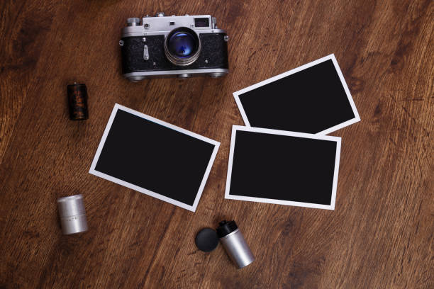 istock Vintage photo camera. Blank photo frames. 658867636
