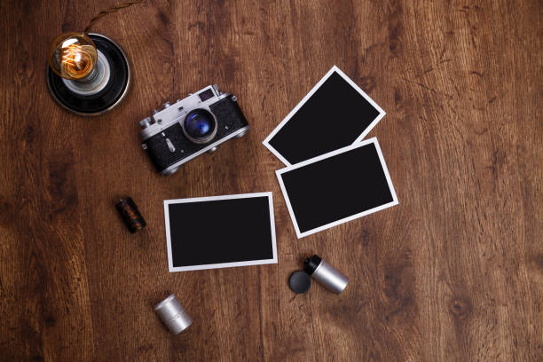 istock Vintage photo camera. Blank photo frames. 658867692