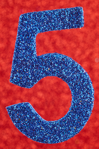 Number five blue color over a red background. Anniversary. Vertical