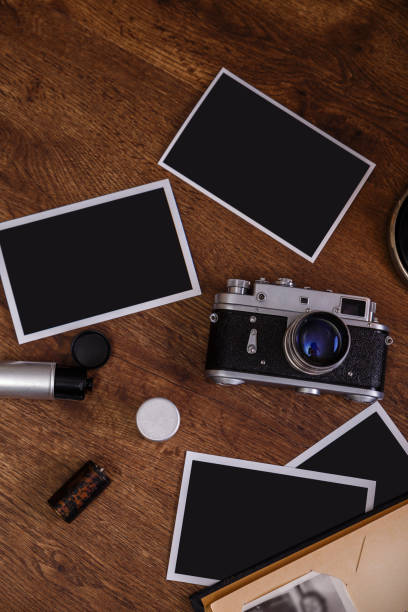 istock Vintage photo camera. Blank photo frames. 658867840