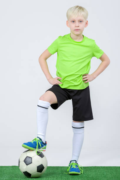 istock Blue-eyed Blond Boy Soccer Player 658871322