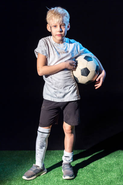 istock Cute Boy Street Soccer Player 658871398