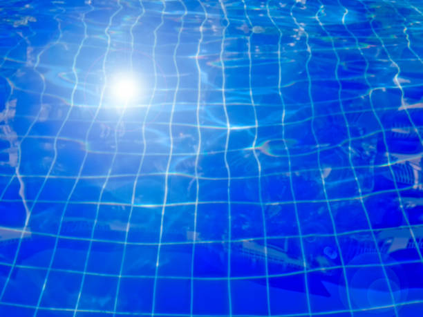 istock Blue swimming pool rippled water background 658873160