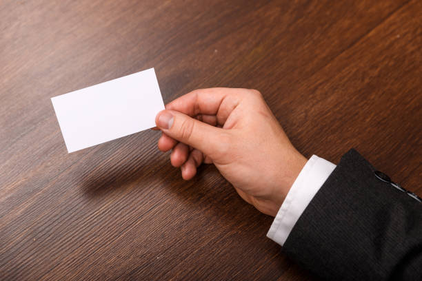 istock Hand hold blank business card design mockup. 658880360