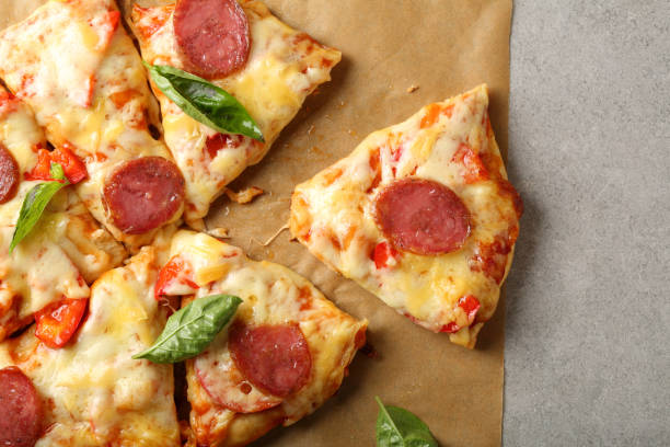 istock Italian pizza on gray background, food top view 658883434