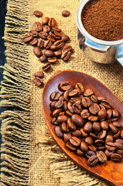 istock Grains of coffee on a jute background. Ground coffee 658889842
