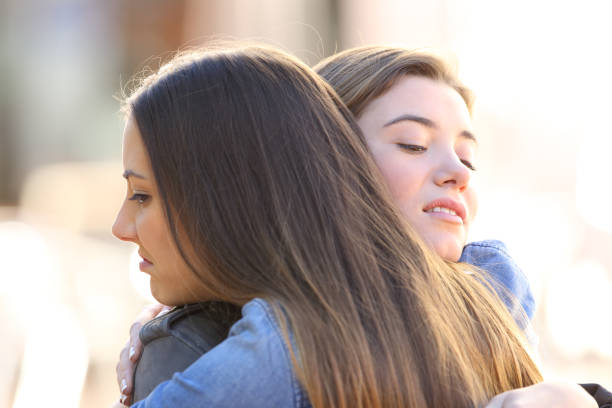 istock Hypocritical angry friends embracing 658890568