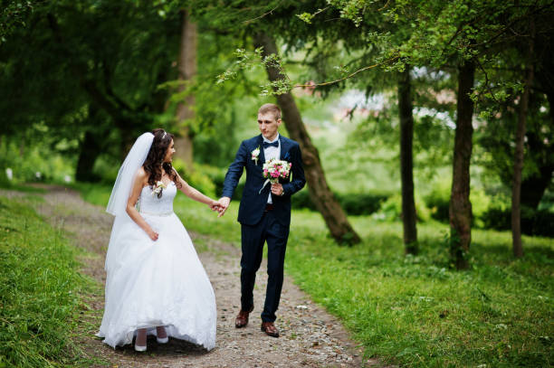 istock Young stylish wedding couple in love at park. 658890696