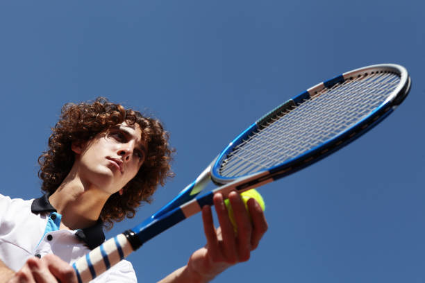 istock tennis player with racket during a match game 658890766