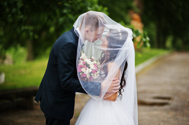 istock Young stylish wedding couple in love at park. 658893268
