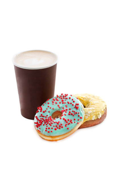 istock Cup of coffee with tasty donuts isolated 658894180