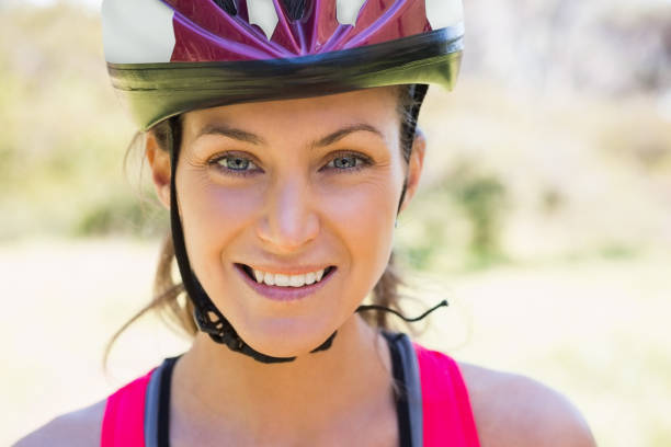 istock Fit smiling woman wearing helmet 658894556