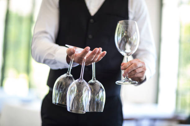 istock Waiter holding wine glasses 658897488