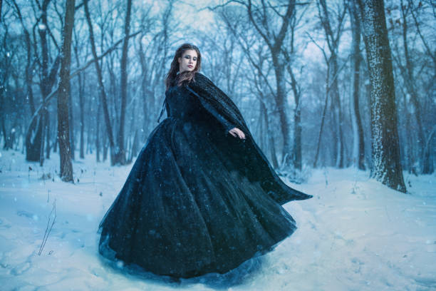 istock Young girl walking in winter forest 658897604