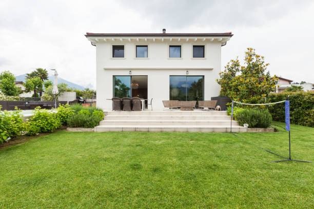 istock View of house, external with garden and pool 658898482