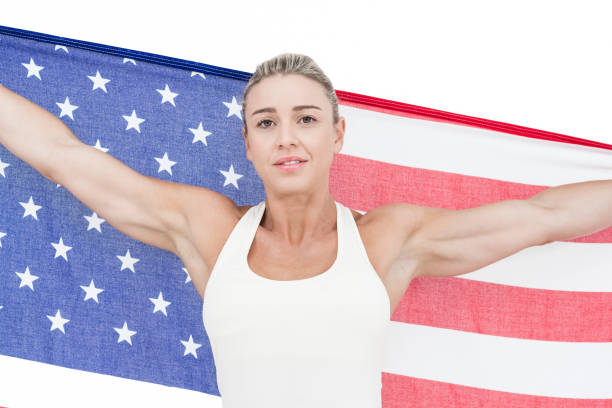 istock Female athlete holding American flag 658899022
