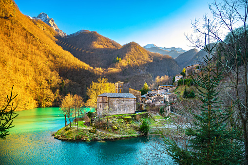 Isola Santa medieval village, church and lake. Garfagnana, Tuscany, Italy.