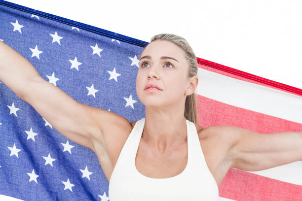 istock Female athlete holding American flag 658902324