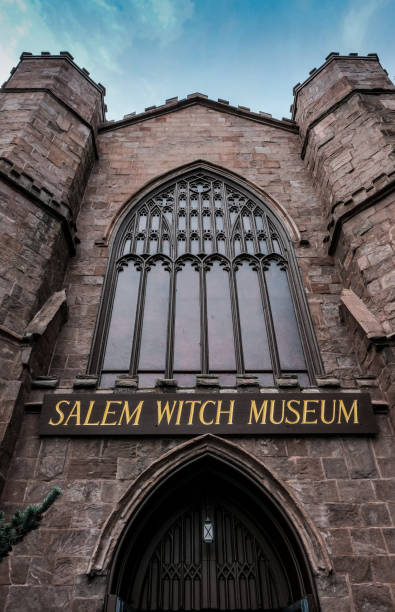 Salem, MA, USA - September 27 2016: Gothic styled building and entrance for a popular tourist attraction as seen in Salem, MA. Gothic styled building and entrance for a popular tourist attraction as seen in Salem, MA. The area is famous for the so-called Salem Witch trials and this museum offers visitors education and the history of the area. salem massachusetts stock pictures, royalty-free photos & images