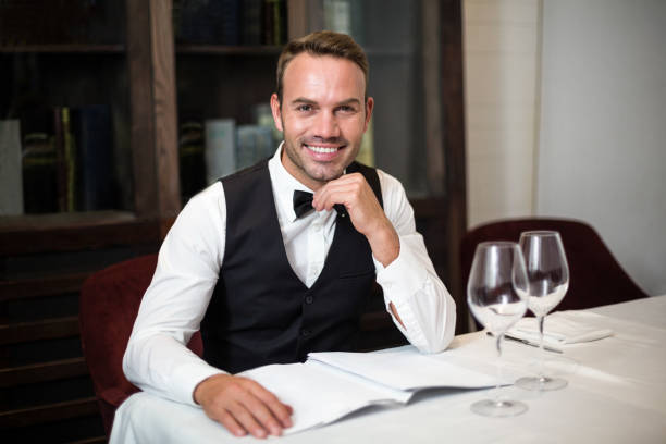 istock Portrait of waiter reading the menu 658902692