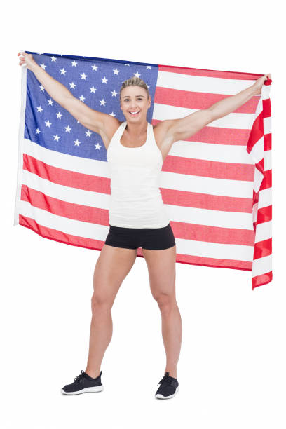 istock Female athlete holding American flag 658906370