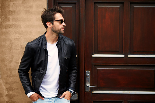 Leather dude in sunglasses, looking away